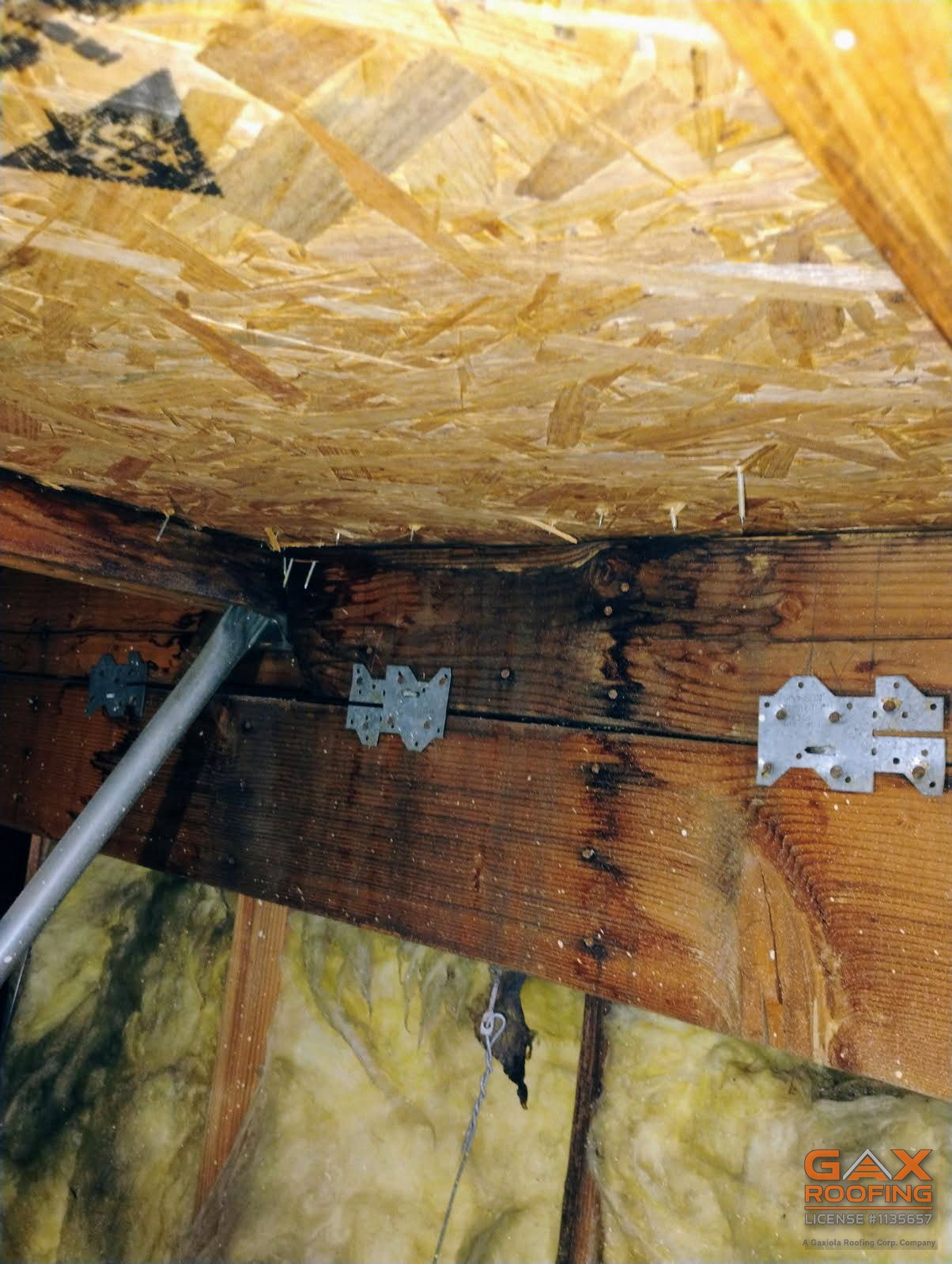 Water staining on a rafter under the roof deck found during an attic inspection in Azusa, CA