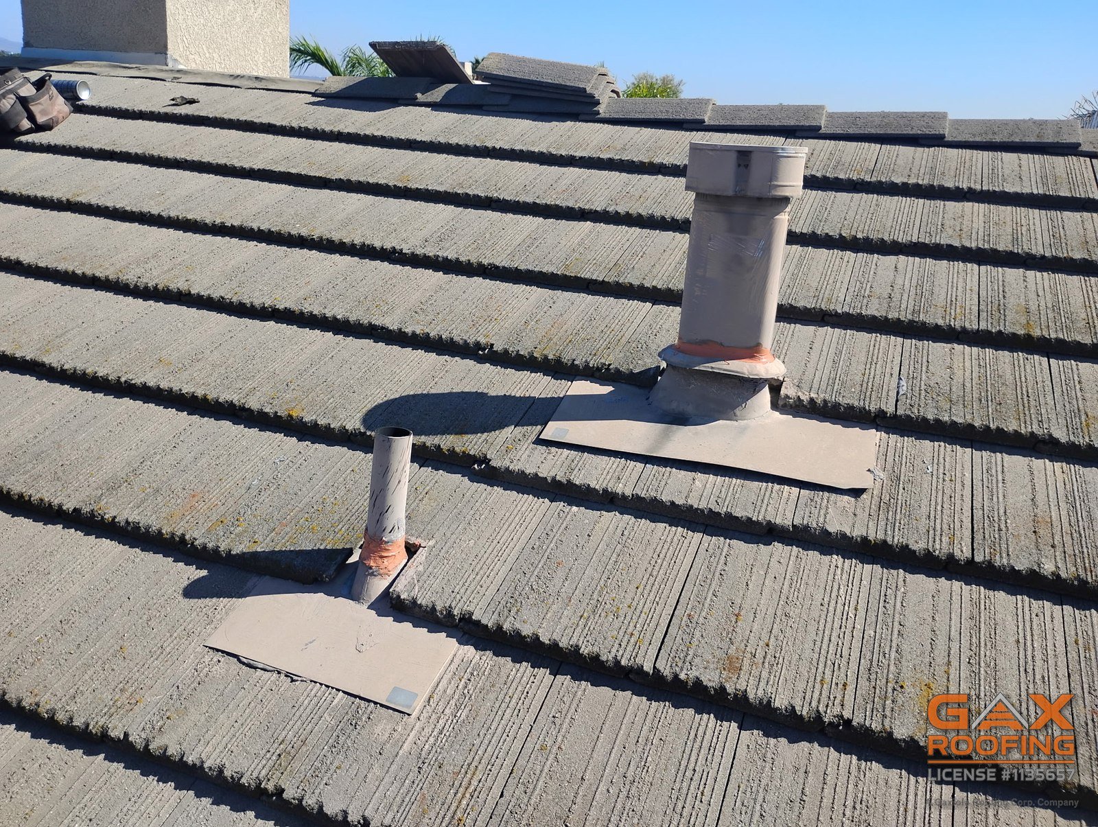 New pipe flashing set into concrete tile on an Arcadia roof
