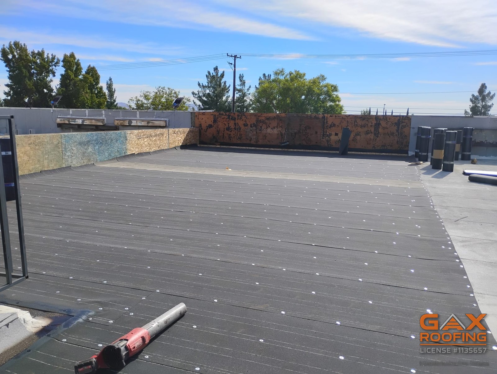 Commercial flat roof replacement in Redlands, CA by GAX Roofing, torch applied Polyglass Polyfresko granulated cap sheet