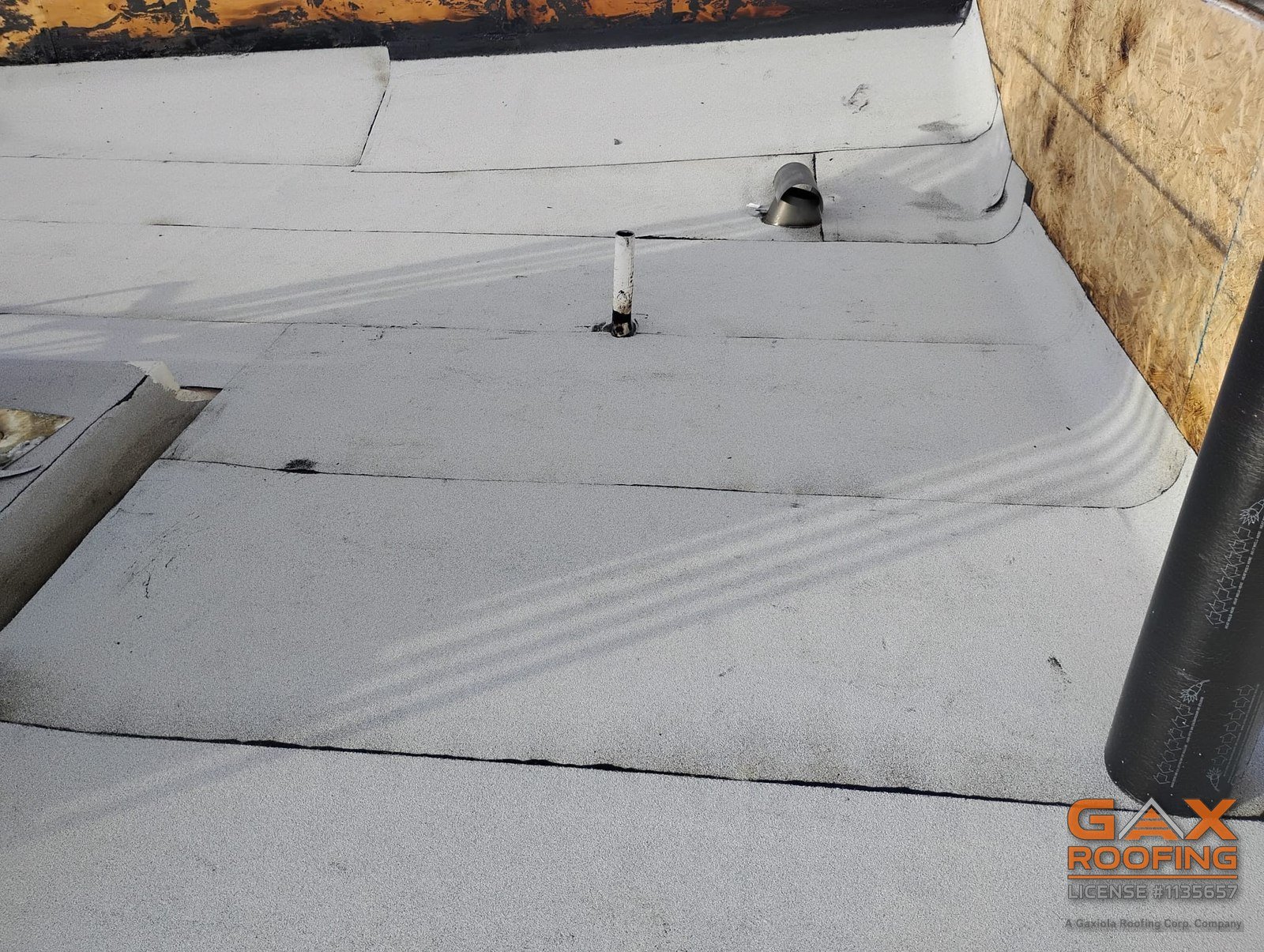 New cap sheet installed over the rebuilt deck on a Redlands commercial flat roof