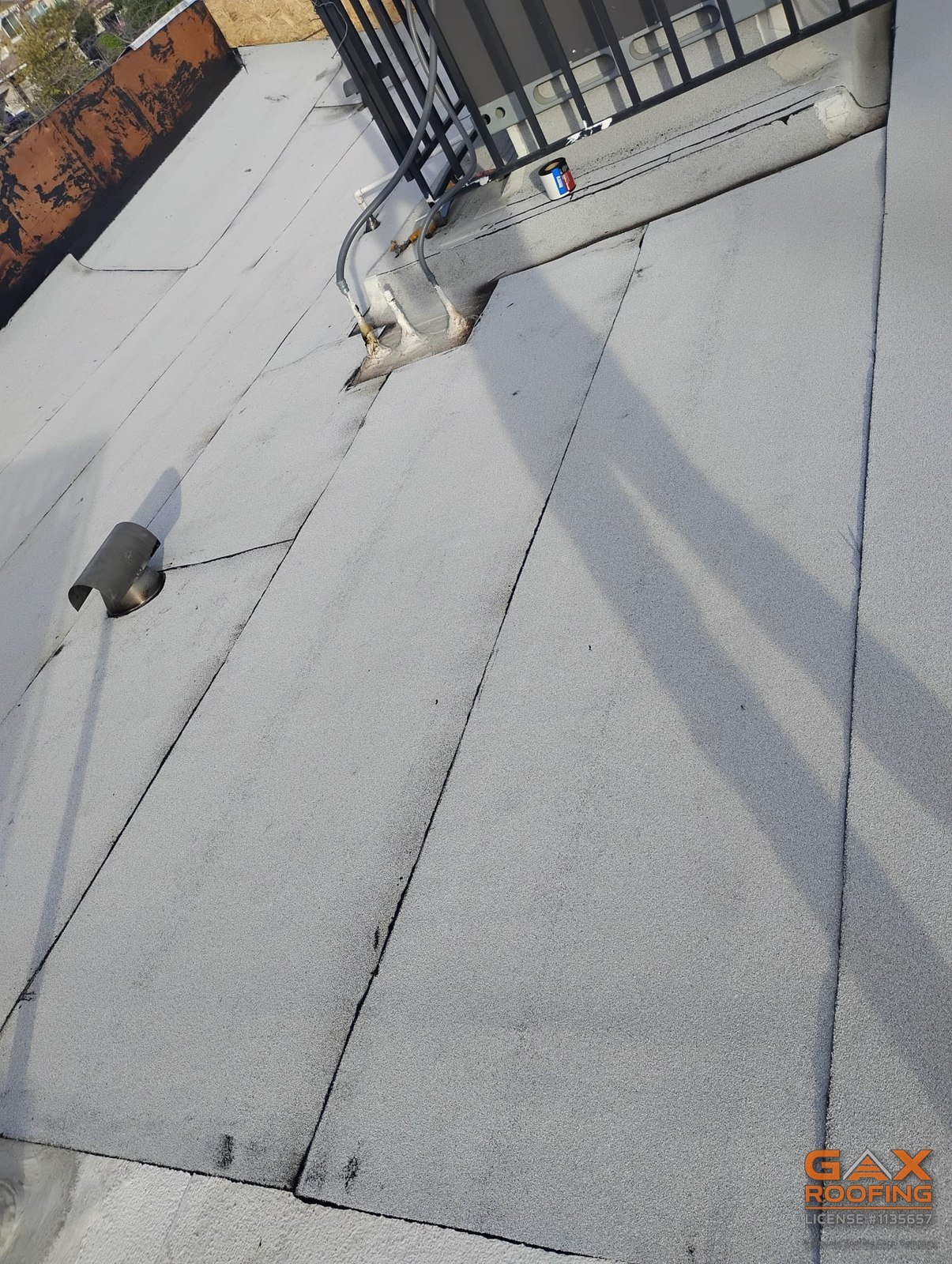 Commercial flat roof replacement in Redlands, CA by GAX Roofing, torch applied Polyglass Polyfresko granulated cap sheet