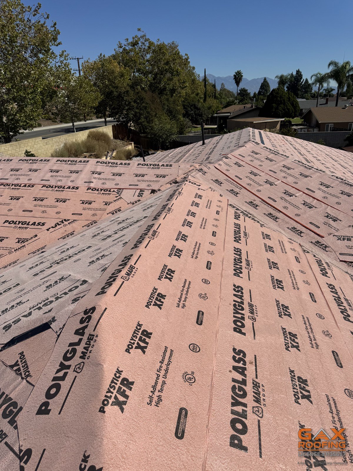 Polyglass XFR underlayment running across the hips of a Chino Hills roof before tile installation