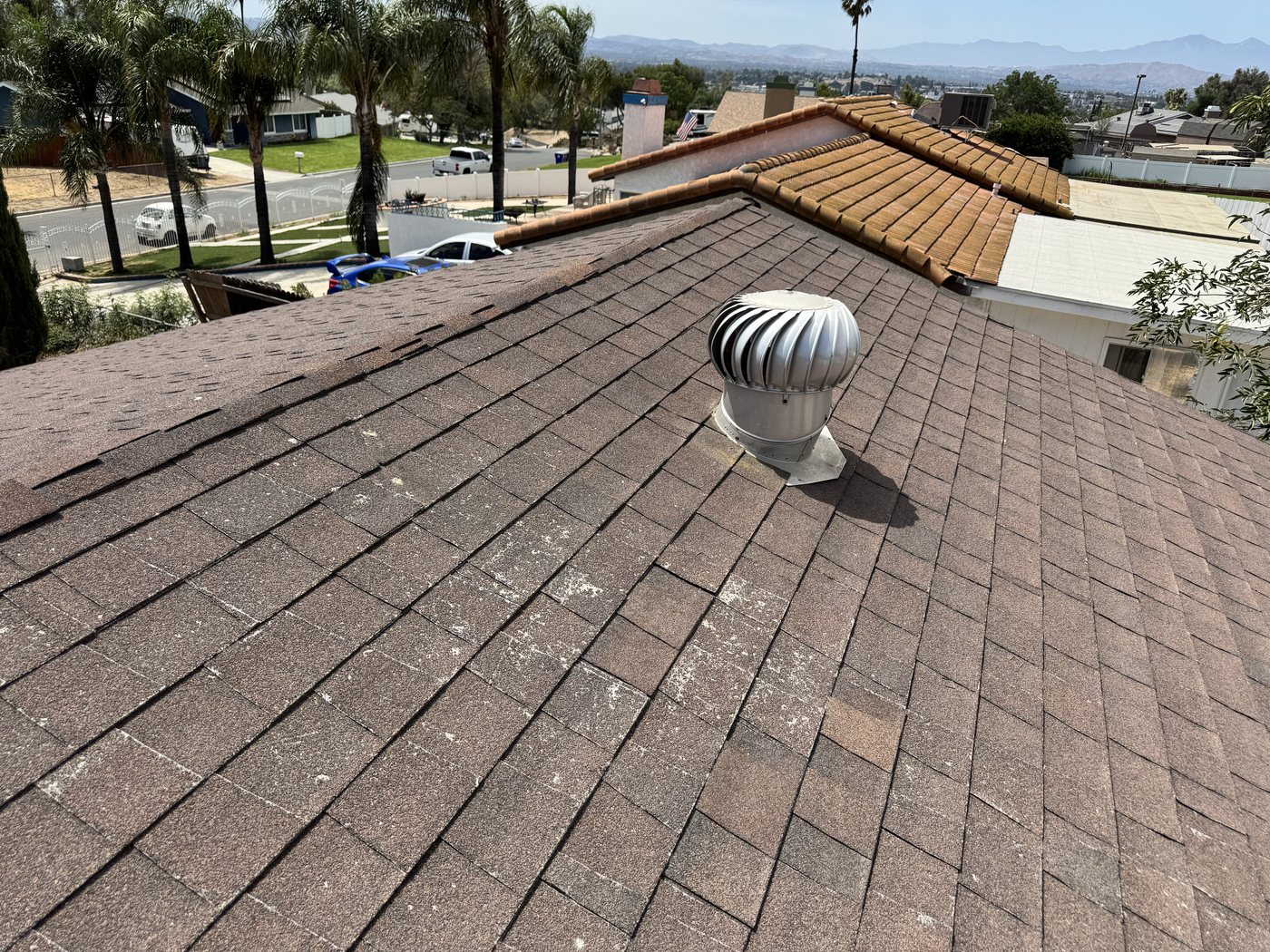 Worn shingle field with granule loss on a Jurupa Valley roof inspection