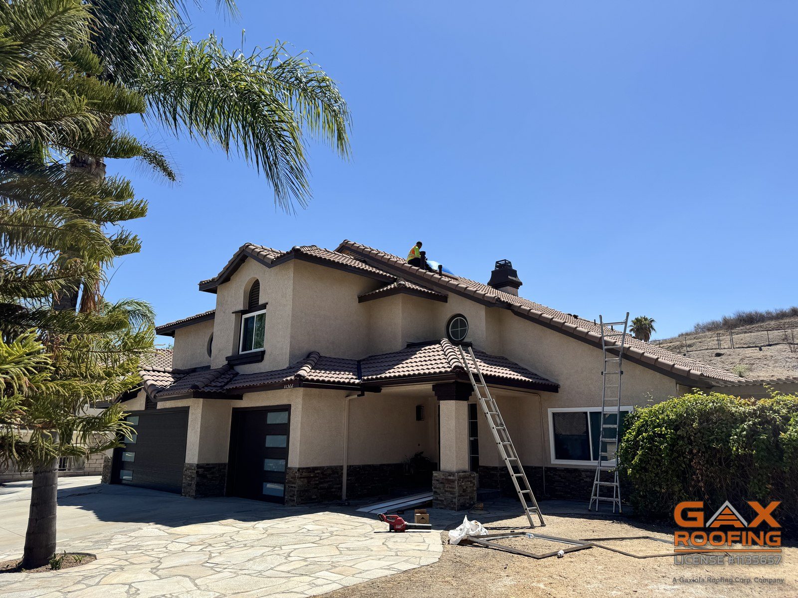 GAX Roofing crew reroofing the Riverside home where a 30 year old skylight was replaced