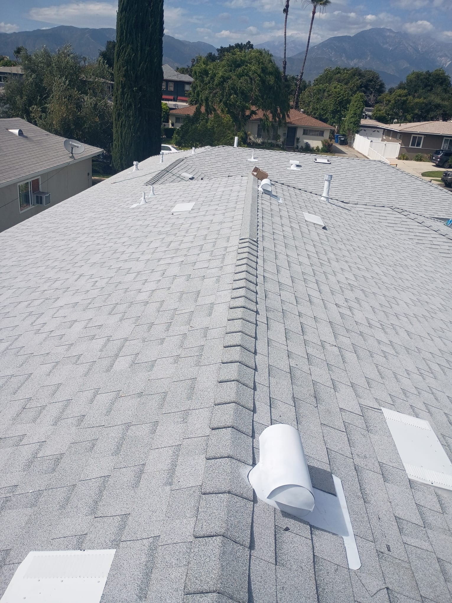 Tan shingle roof replacement in progress GAX Roofing