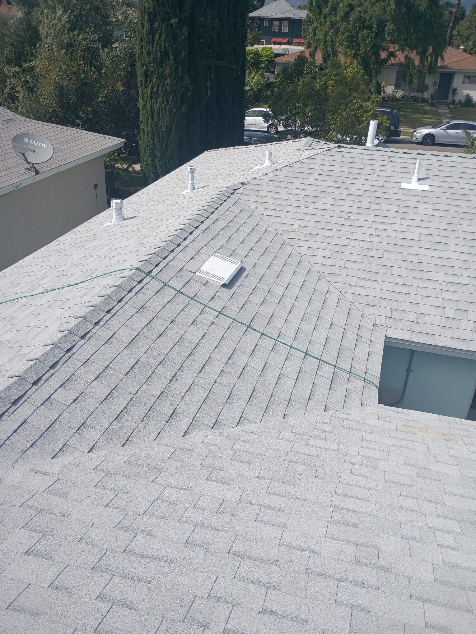 Shingle roof replacement with pool view