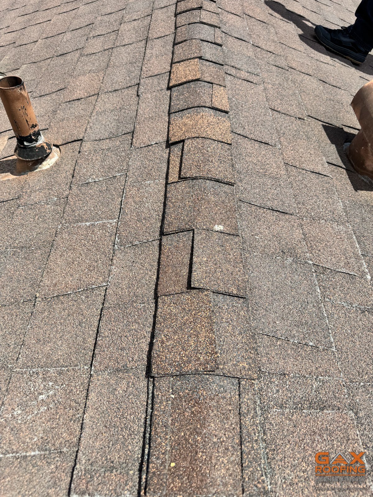 Cracked and lifted shingles found during a GAX roof inspection in Jurupa Valley, CA