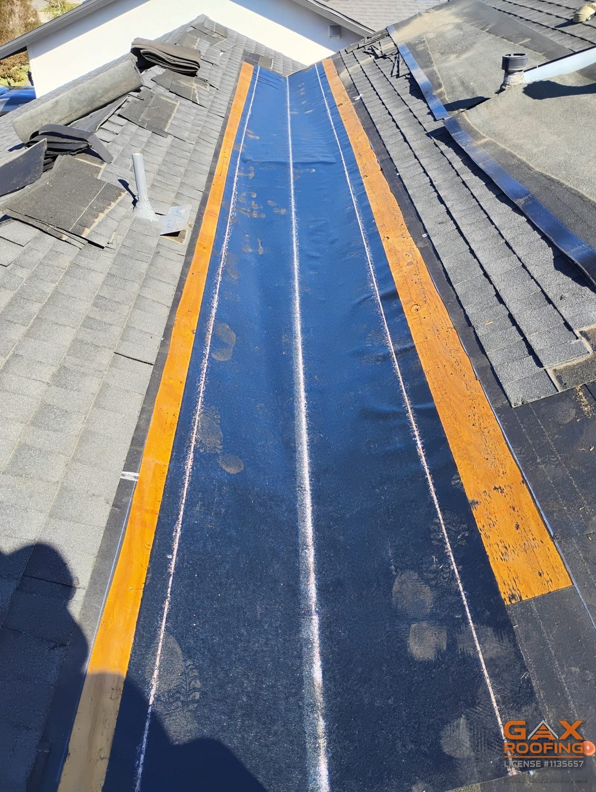 Old roof valley in San Dimas with staining down the center before repair