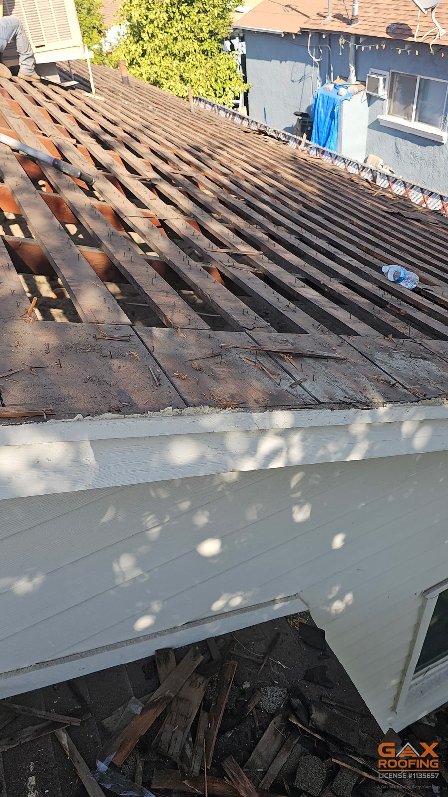 Skip sheathing exposed during the Colton tear-off, spaced boards that cannot hold shingles
