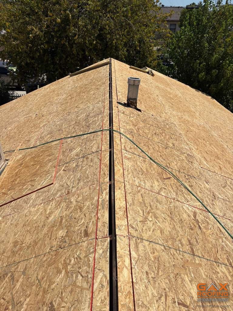 New OSB deck installed over the skip sheathing on the Colton resheet