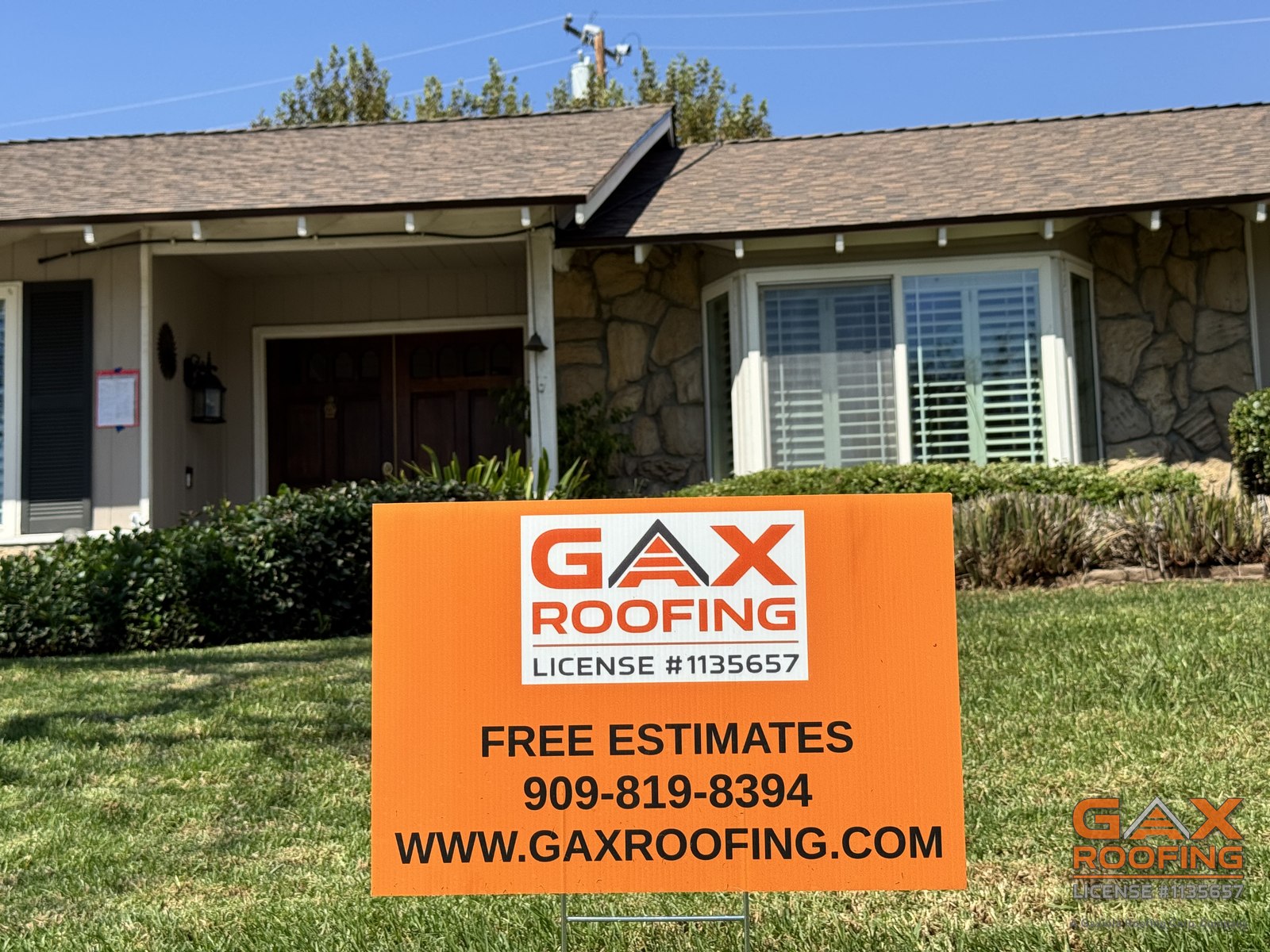 Completed roof replacement with a GAX Roofing yard sign in front of the home in Rancho Cucamonga, CA