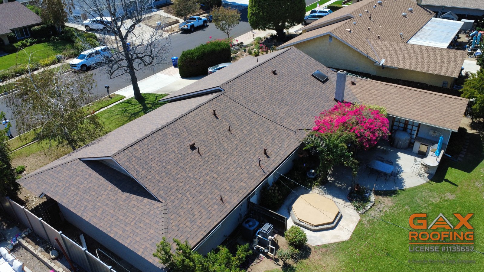 Drone view of a finished shingle roof replacement over a single story ranch home in Rancho Cucamonga, CA