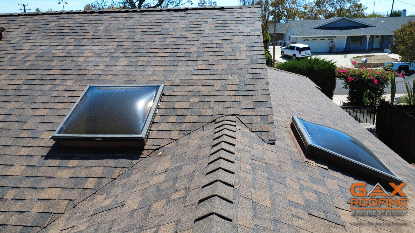 Two skylights and new ridge caps on a completed shingle roof by GAX Roofing in Rancho Cucamonga, CA
