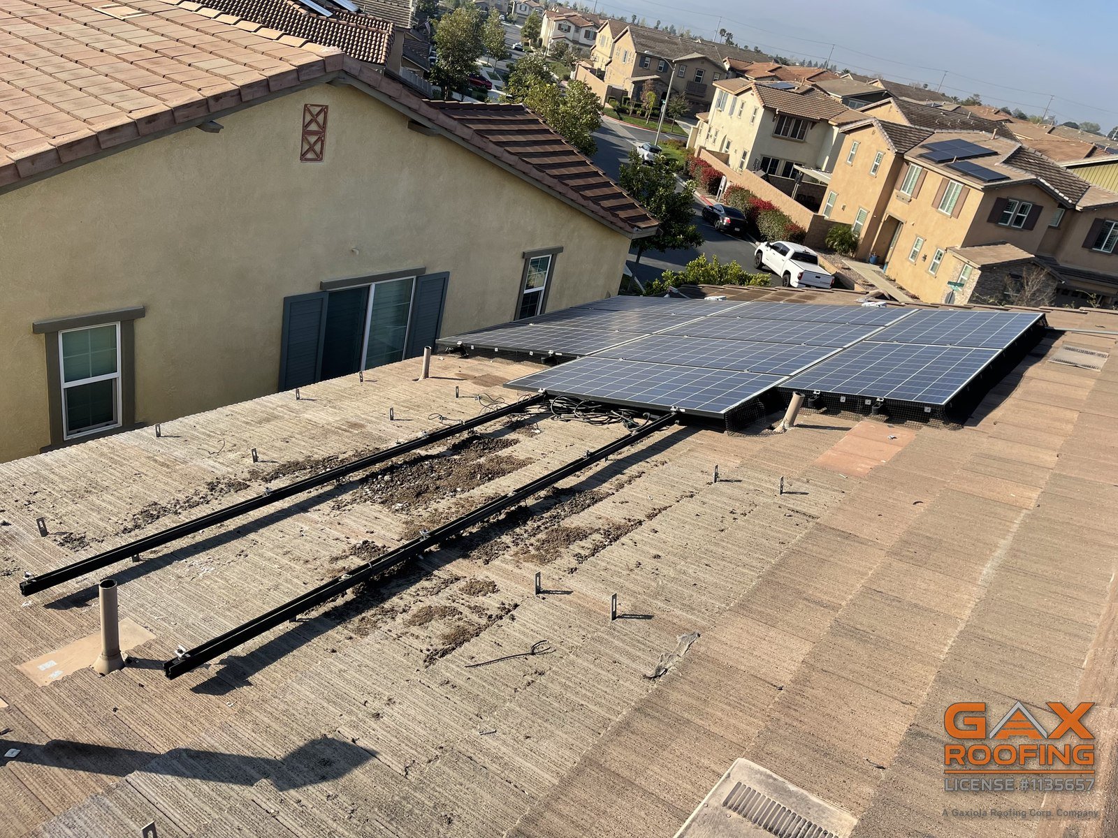 Roof repair under solar panels by GAX Roofing