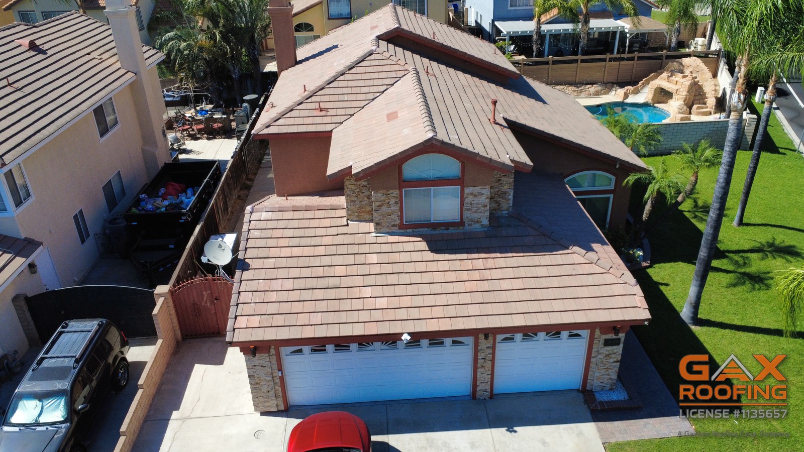 Front drone view of a home after a GAX Roofing tile lift and relay