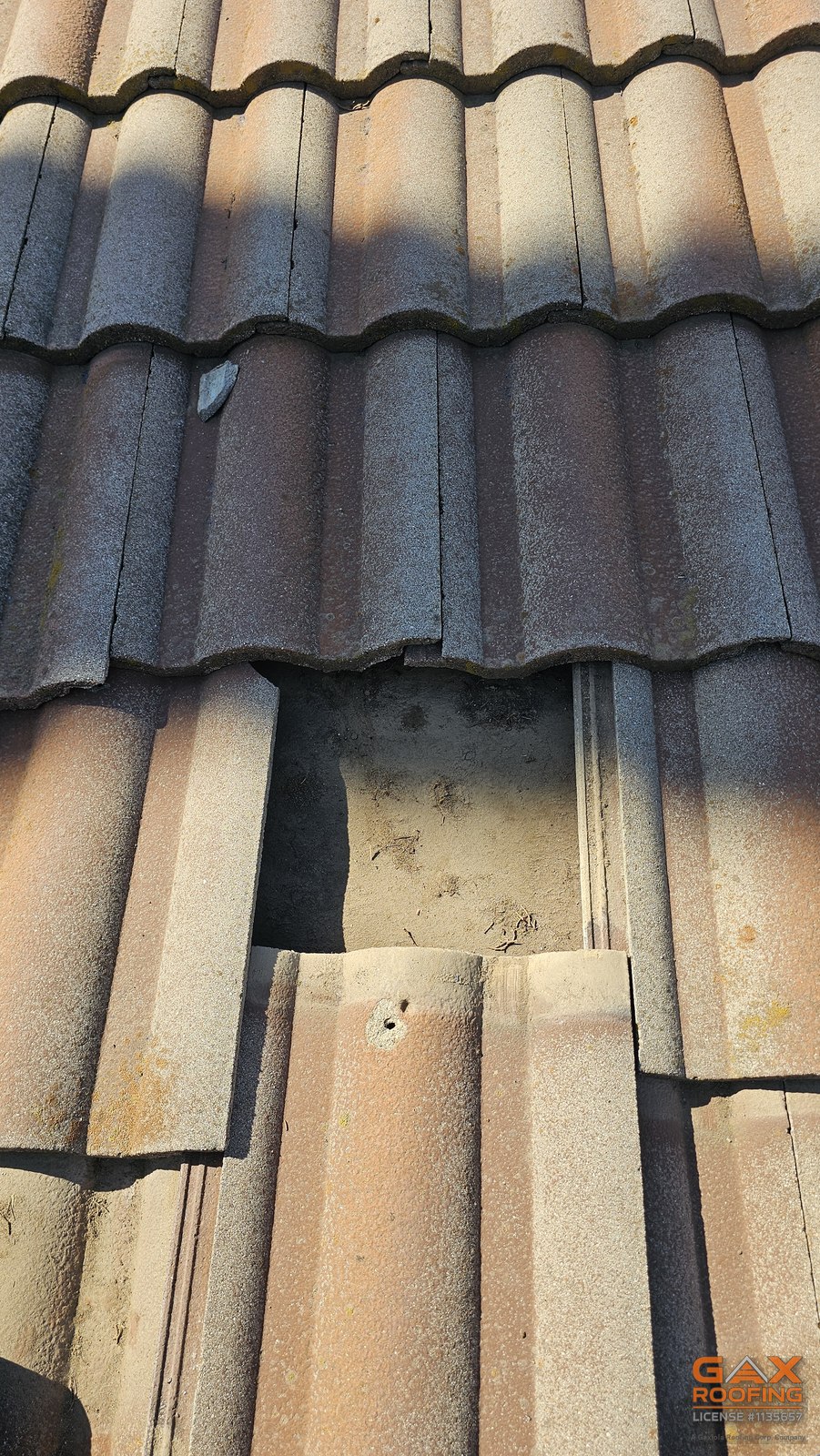Broken ridge and slipped tile on a Rialto, California roof