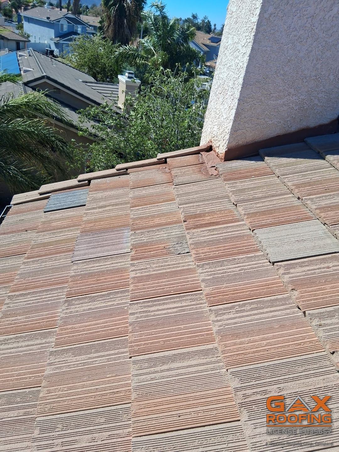 Concrete tile relaid over the repaired section of a tile roof in Hemet