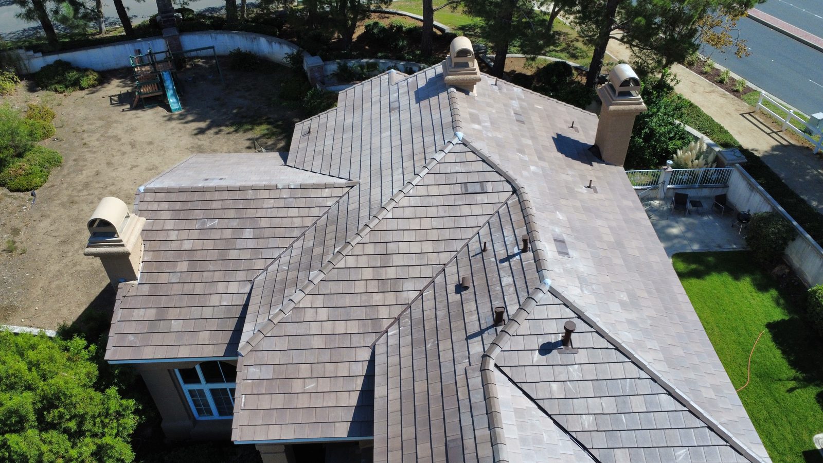 Finished Westlake Royal concrete tile roof on a tile replacement in Etiwanda, Rancho Cucamonga, drone view