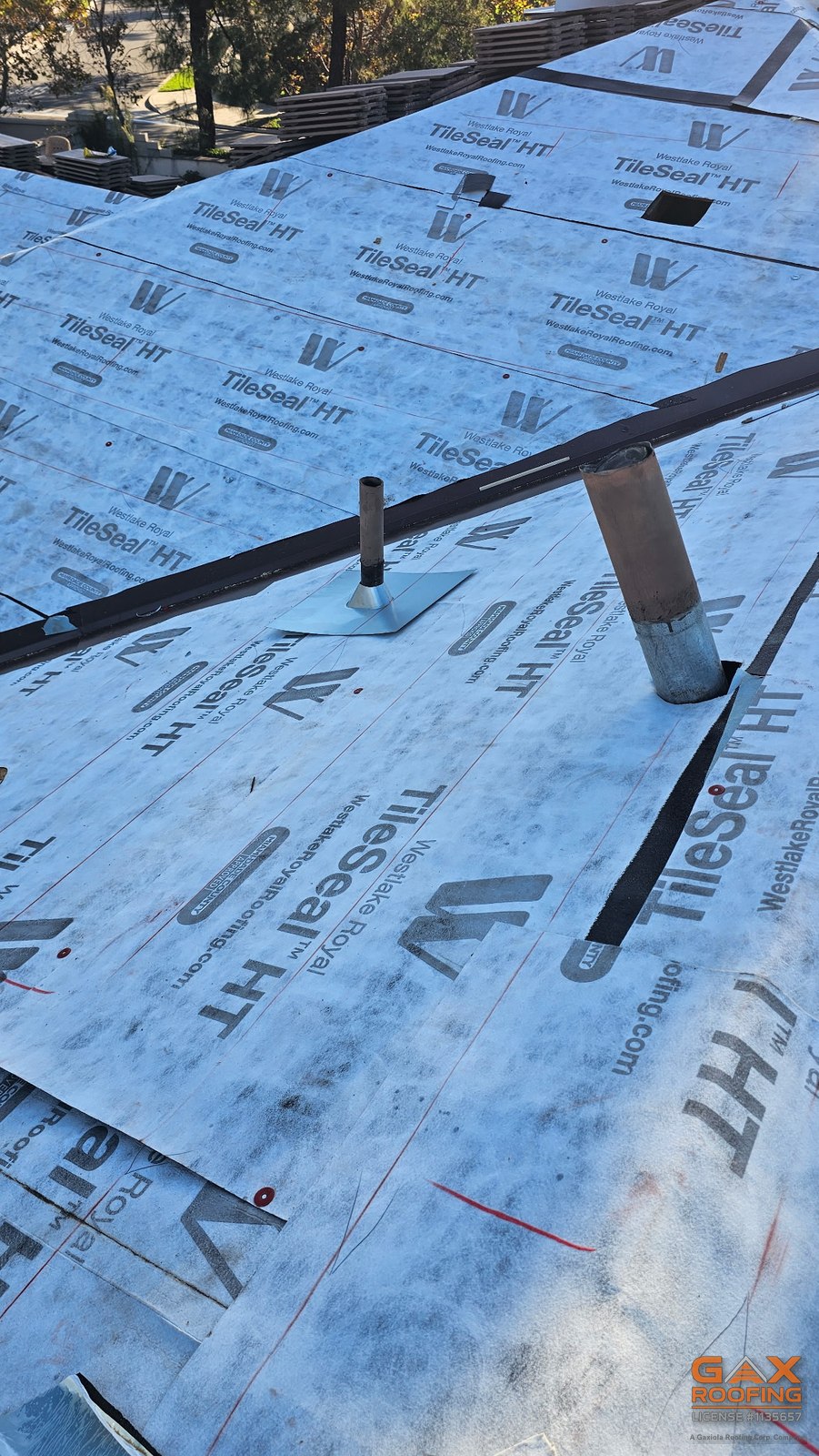 New pipe flashings and metal valley over TileSeal HT underlayment before the tile goes on, Rancho Cucamonga tile replacement