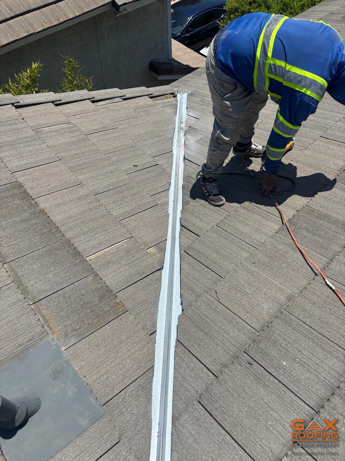 New valley metal installed during a tile lift and relay