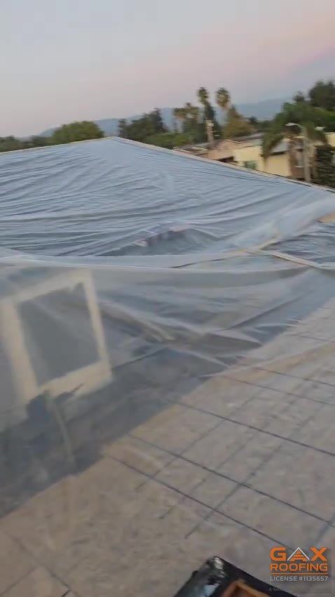 Emergency roof tarp installed by GAX Roofing on a West Covina home